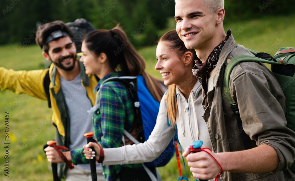 Group of fit healthy friends trekking in the mountains Group of fit healthy friends trekking in the mountains