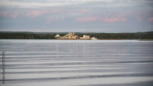 Dredge cleans bottom from silt, go deeper of riverbed, extracts sand, gravel, crushed stone or minerals, full HD stock video footage in real-time