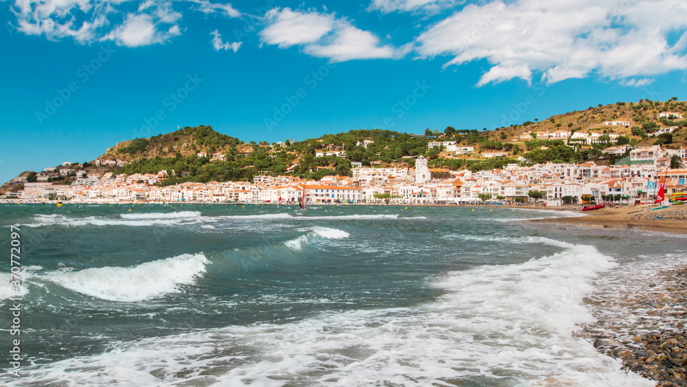 Catalonian coastal village Port de la Selva with Mediterranean sea in foreground, panoramic view