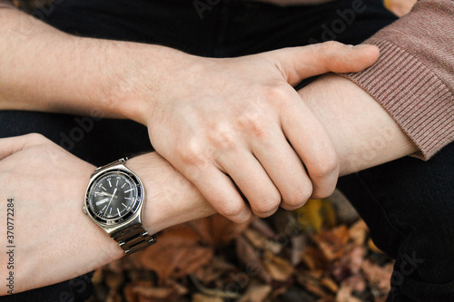 male hands and wrist watch close up