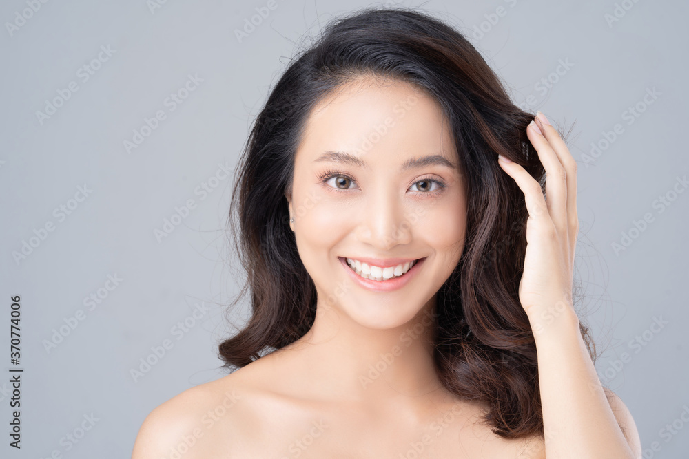 Beautiful female asian face with natural perfect skin in studio portrait Beautiful female asian face with natural perfect skin in studio portrait