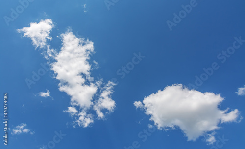 White clouds in the blue sky.