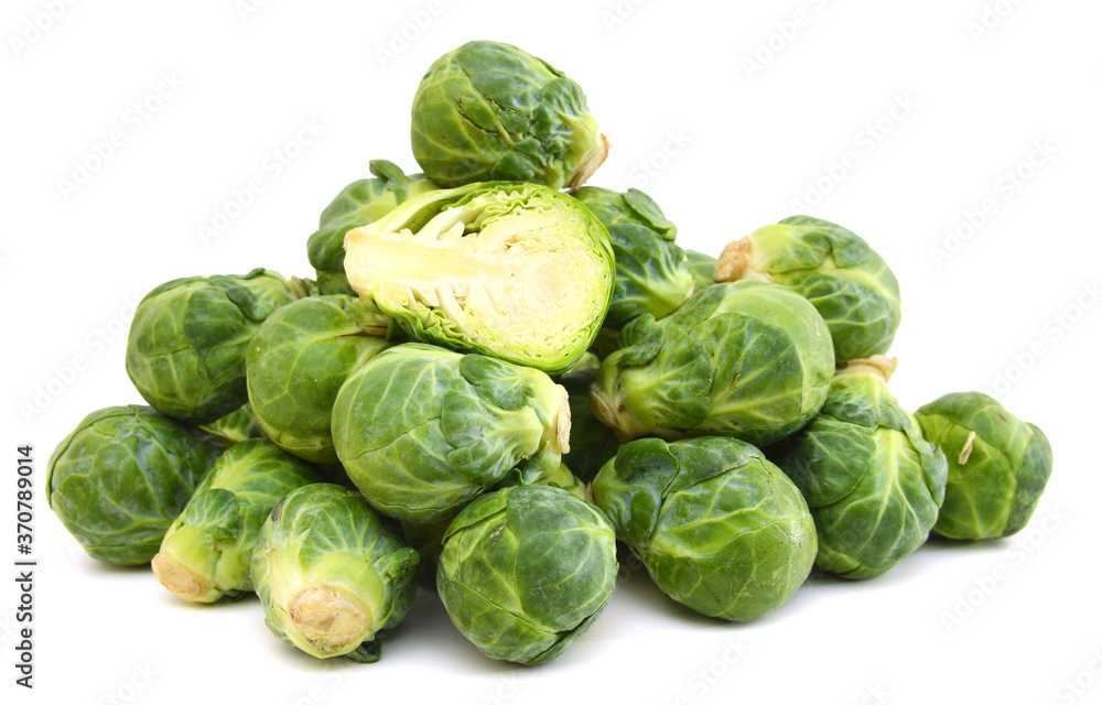 freshly brussel sprouts and some whole ones on a white background freshly brussel sprouts and some whole ones on a white background