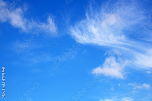Blue sky with delicate white clouds. Can be used as background