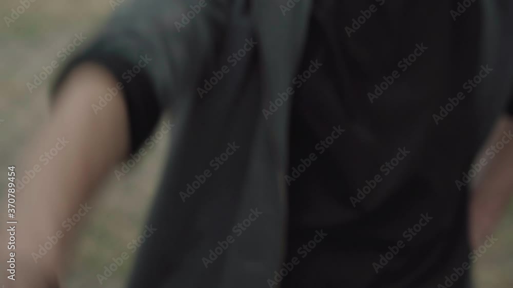 Close-up of hands stack of multiracial male friends. Unrecognizable young Caucasian and African American men putting palms at top of each other. International friendship and equality concept. Close-up of hands stack of multiracial male friends. Unrecognizable young Caucasian and African American men putting palms at top of each other. International friendship and equality concept.