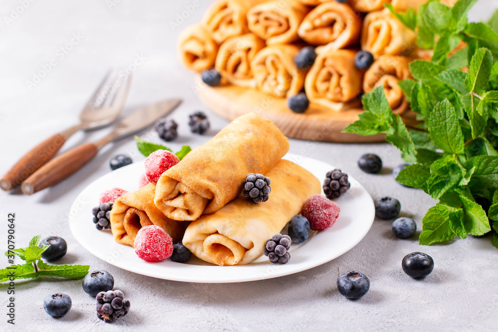 Thin pancakes with cottage cheese. Delicious sweet rolled pancakes