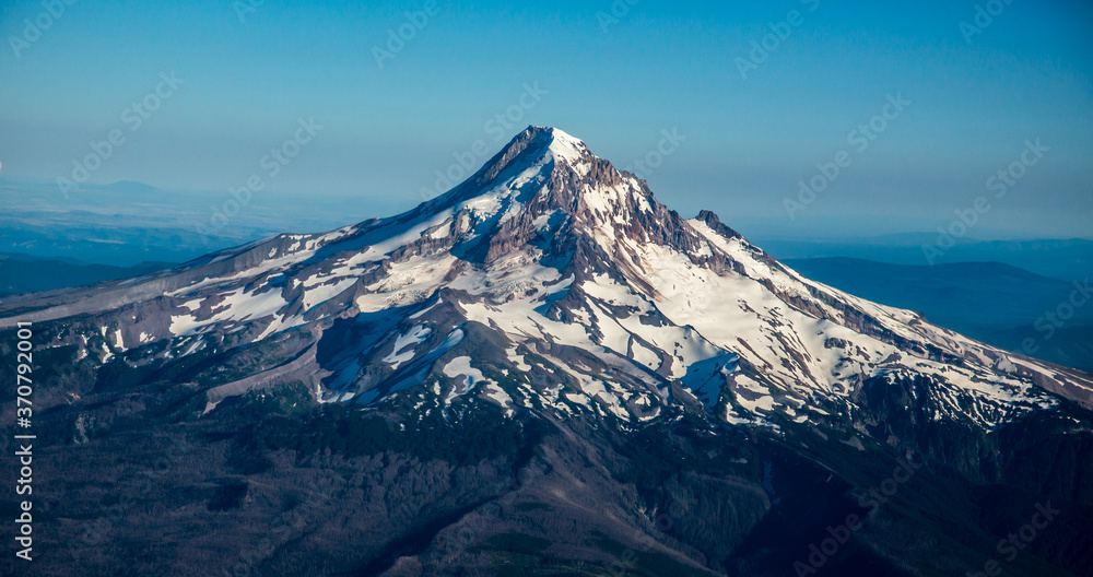 A summer aerial shot of Mt Hood with much of its snow melted