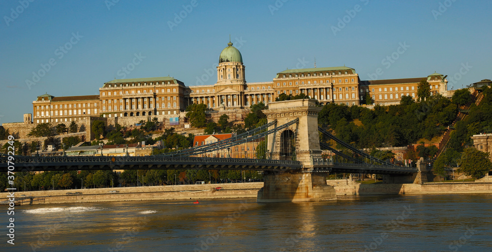 Looking accross the Danube river at the Szechenyi Chain Bridge and Buda castle and National museum, Budapest, Humgary