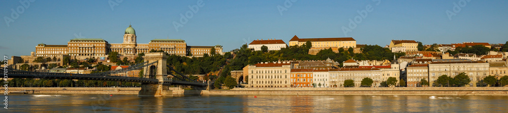 The Buda castle and National museum and other buildings line the banks of the Danube river in Budapest, Hungary