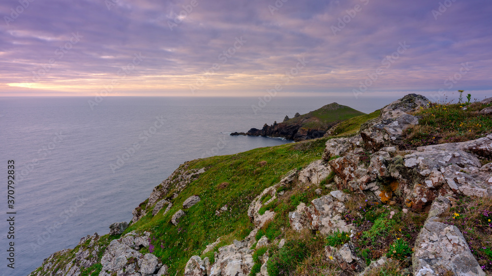 Summer sunset over The Rumps and Pentire Head on the North Coast of Cornwall, UK Summer sunset over The Rumps and Pentire Head on the North Coast of Cornwall, UK