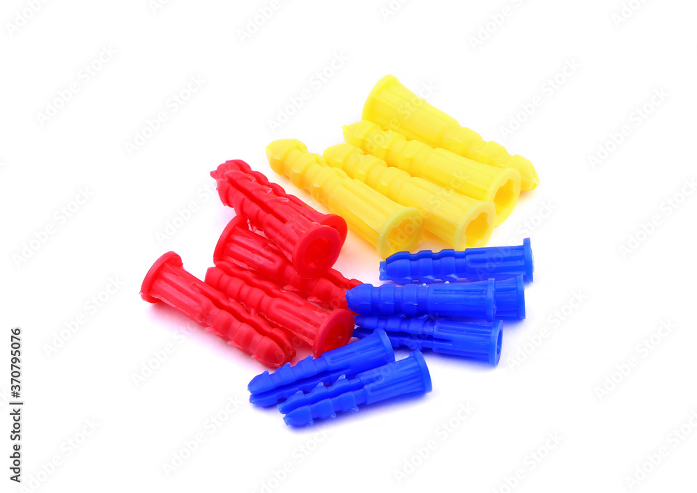 Set of colorful dowels, wall plugs isolated on a white background. Dowels, wall plugs Set of colorful dowels, wall plugs isolated on a white background. Dowels, wall plugs