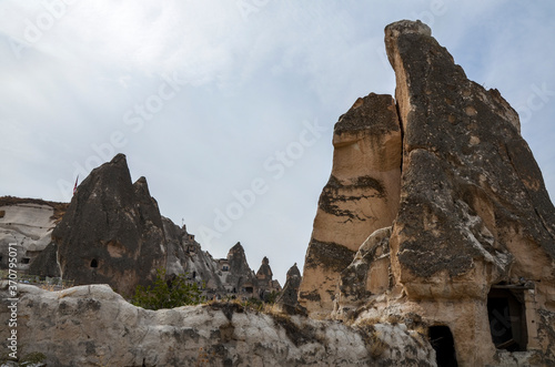 Rock formations of stone houses near the ancient cave city of Goreme in Cappadocia, Turkey