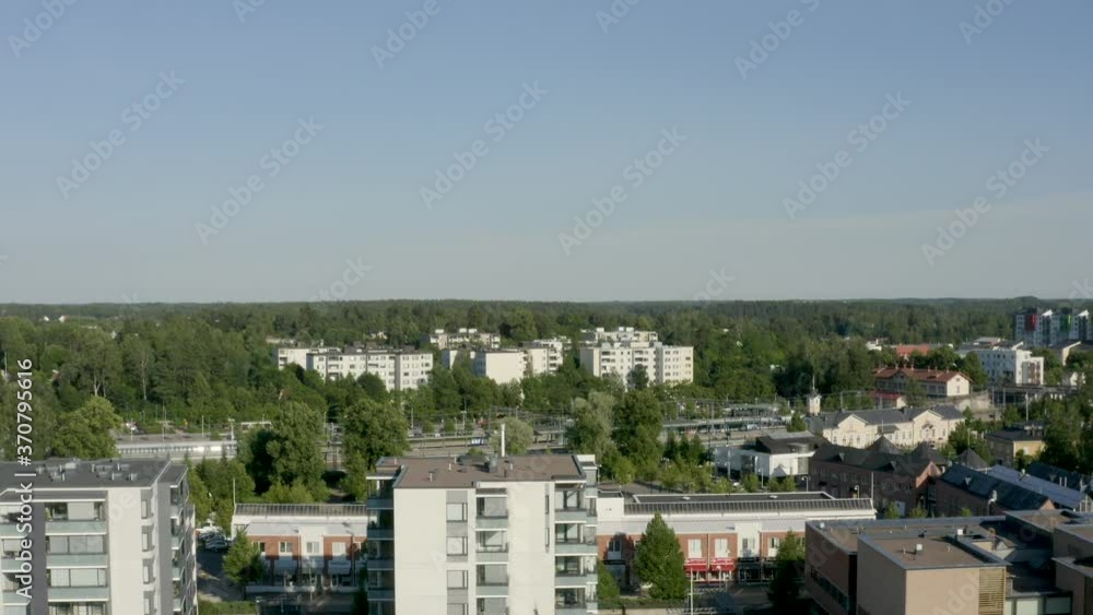Quick rising aerial view of a small river and train station in a Finnish city near Helsinki. Quick rising aerial view of a small river and train station in a Finnish city near Helsinki.