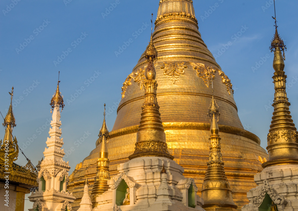 Evening light falling on the golden Shwedagon Pagoda in Yangon, Myanmar