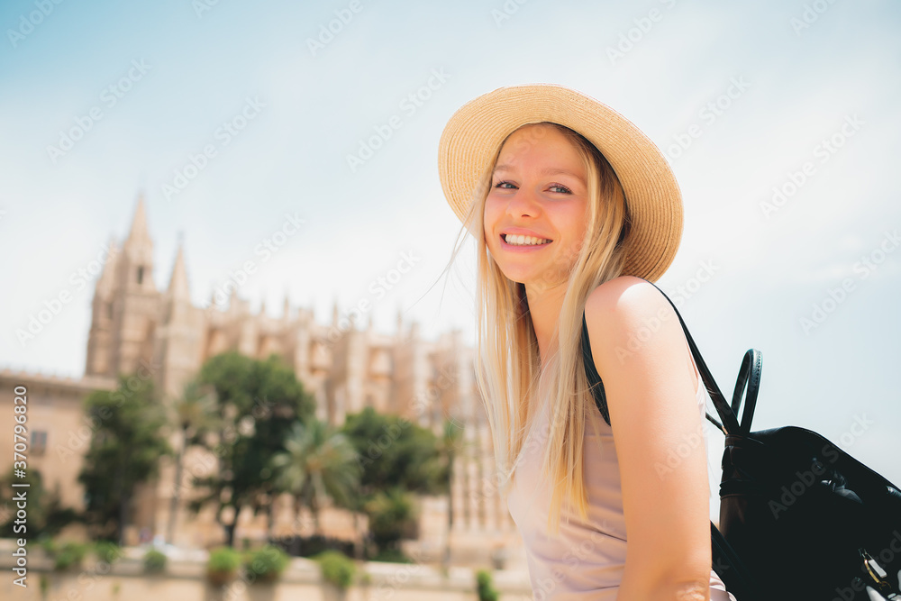 Adventure time - Attractive caucasian smiling girl tourist in hat exploring new city at summer