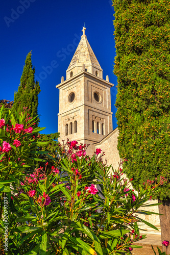 Bell tower of St George Church in Primosten town, a popular tourist destination on the Dalmatian coast of Adriatic sea in Croatia, Europe.