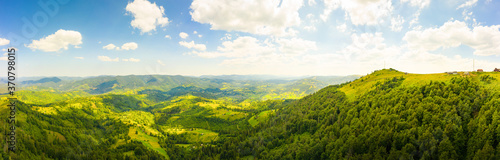 180 degrees scenic panoramic landscape of nature in Carpathians, Ukraine. Beautiful mountains and forests on slopes