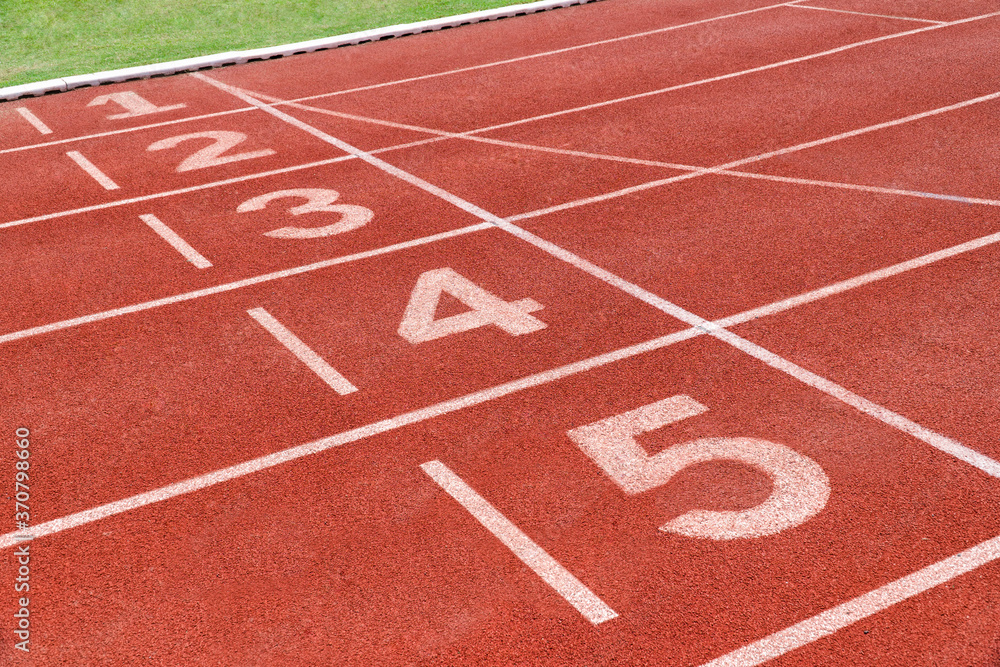 Running track with number in stadium. Close up start position in athlete track.
