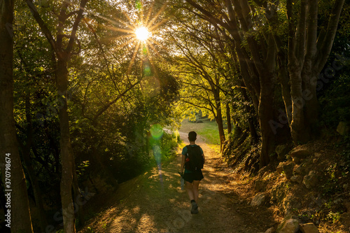 Treekking at dawn leaving Girona with a hiker on the way. © Pablo Eskuder