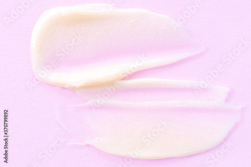 Cosmetic cream close-up. Macro photo. The concept of cosmetic products  skin and hair care  beauty and health. Background image in trendy pink.