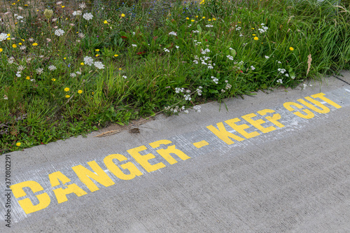 Text Danger Keep Out at an airport.