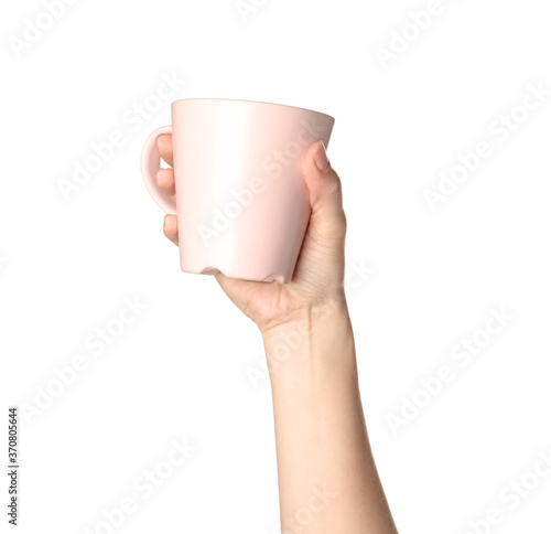 Woman holding pink cup on white background, closeup
