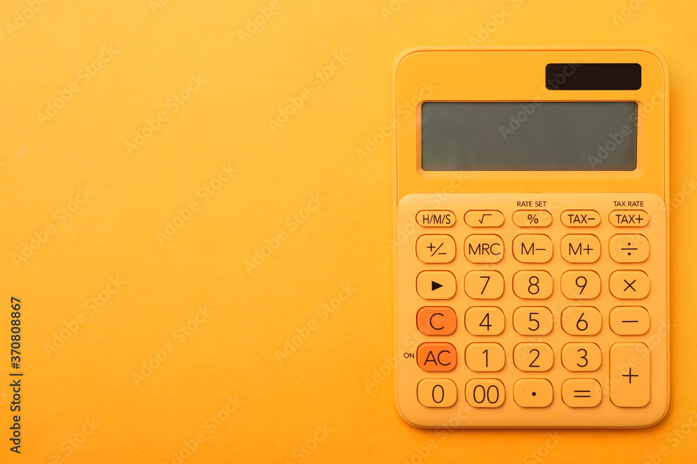 Calculator on orange background, top view with space for text. Tax accounting concept Calculator on orange background, top view with space for text. Tax accounting concept