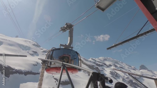 Winter Riding Adventure On A Cable Car Over The Scenic Mount Titlis In Swiss Alps, Switzerland - Medium Shot