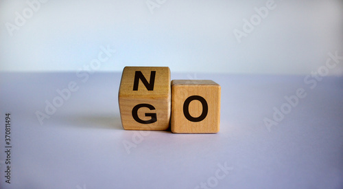 Turning cube and changed the word 'go' to 'no'. Beautiful white background. Business concept. Copy space.