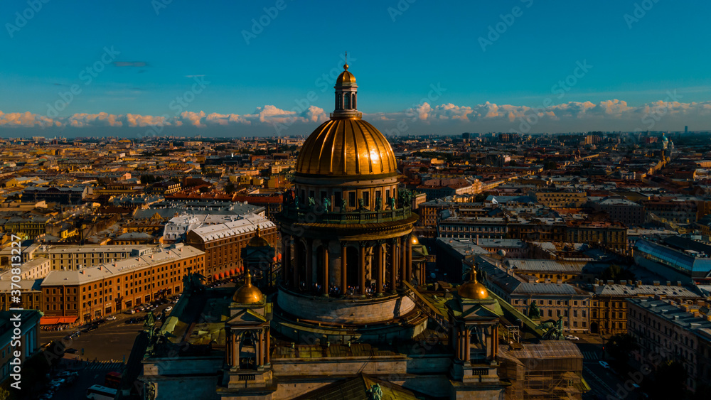 Aerial view of the Kazan Cathedral on a clear summer day, the copper dome, gold cross, columns, Nevsky Prospekt, the singer's house, Griboyedov Canal, Herzen University