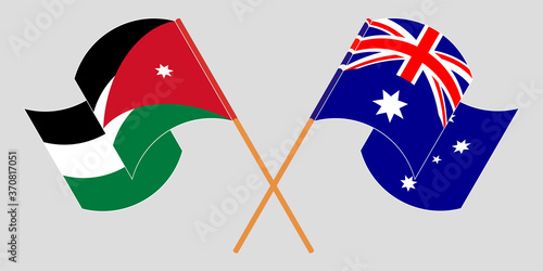 Crossed and waving flags of Jordan and Australia