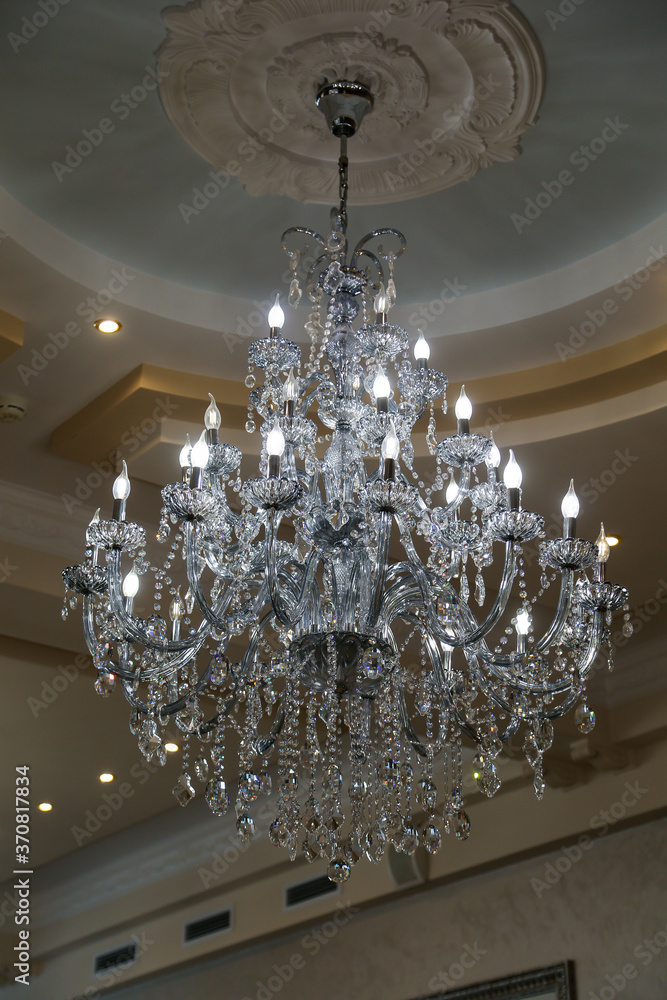 beautiful shiny chandelier hanging from the ceiling
