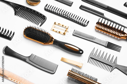 Composition with hair combs and brushes on white background, above view