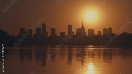 View of the setting sun over the panorama of Warsaw, time lapse . Sunset in Warsaw.