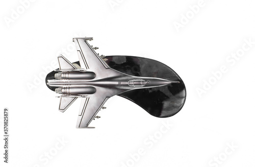 silver model of fighter plane isolated on white background