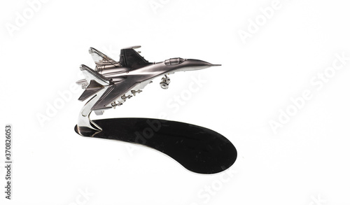 Valokuva silver model of fighter plane isolated on white background