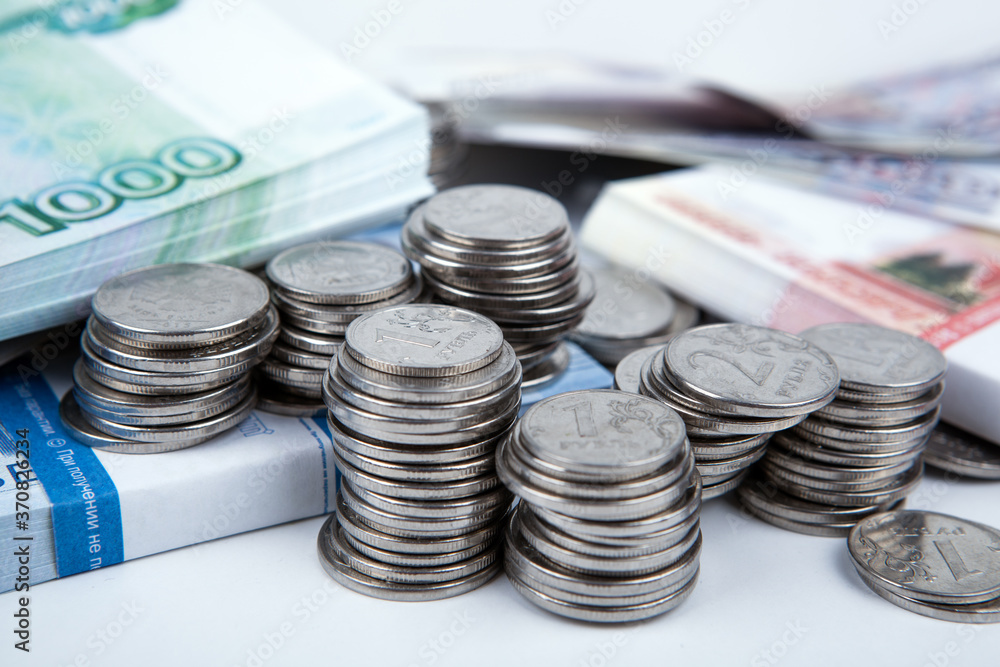 a bundle of russian banknotes and many Russian coins a bundle of russian banknotes and many Russian coins