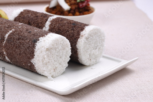 Ragi Puttu or Finger Millet  steamed cake with bengal gram curry photo