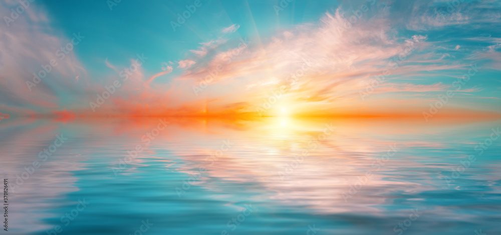 Panorama of morning dramatic sky with bright sun above water surface