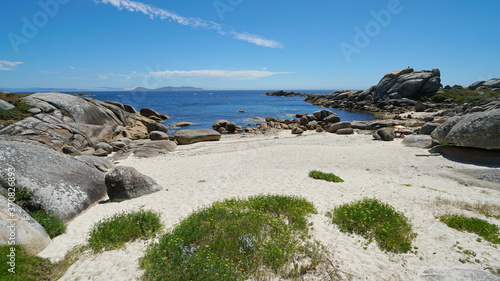 Sandy beach with boulders on the coast of Galicia, Spain, Atlantic ocean, province of Pontevedra, Praia Abelleira, San Vicente do Grove photo