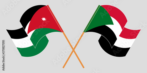 Crossed and waving flags of Jordan and Sudan