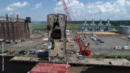 Aerial view of crane dismantling part of old power plant in Sayreville, NJ