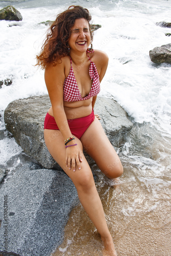 Young woman enjoying a day on the beach Young woman enjoying a day on the beach