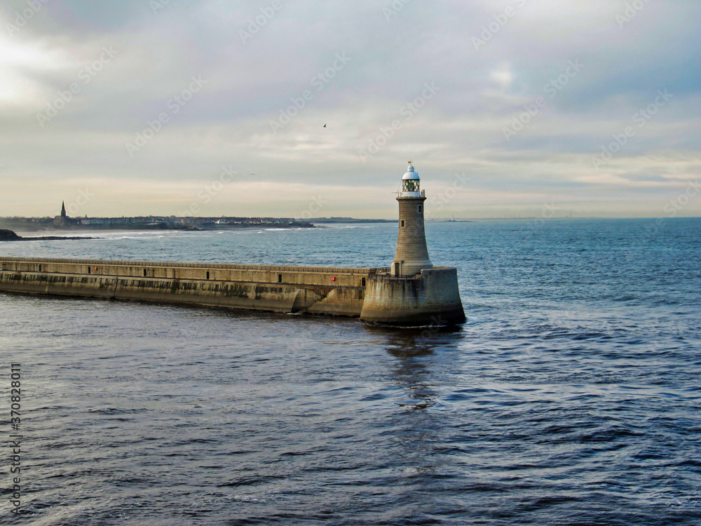 Lighthouse at the end of the pier of Newcastle Harbor on the River Tyne, UK