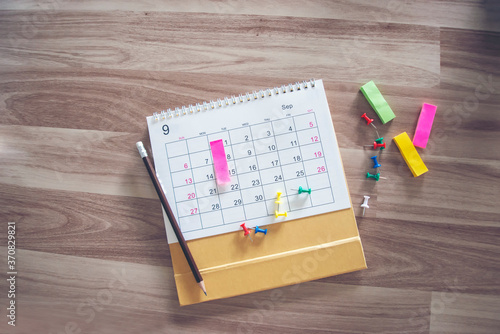 Photos Pins on Calendar for Planner and organizer to plan and reminder daily appointment, meeting agenda, schedule, timetable, and management of job, Work online from home