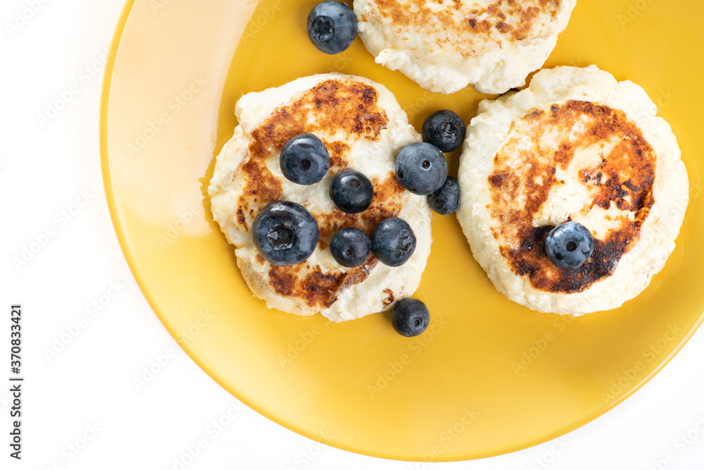 Above closeup view of cheese pancakes with blueberry Above closeup view of cheese pancakes with blueberry
