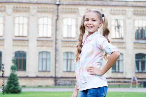 Little girl casual style teen with gorgeous curly hairstyle, stylish fashionista concept