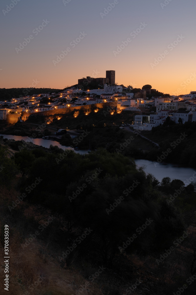 Obraz premium Mértola castle at sunset, the lights were lit when i took this photo