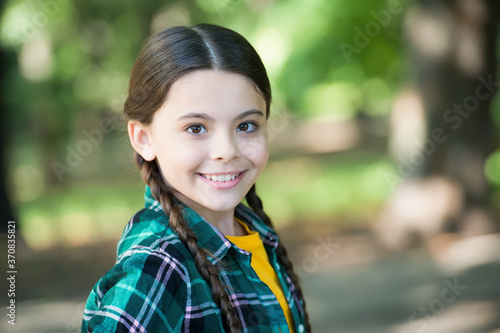 Girl scout cute braids wear checkered clothes nature background, positive thinking concept