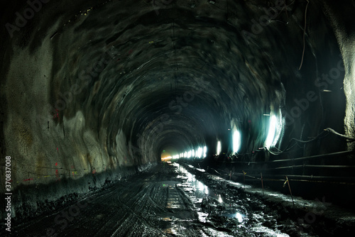 Dirty soil in underground mine during mining work photo